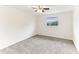 Spacious bedroom with ceiling fan and neutral carpeting at 200 Country Club Dr # 802, Largo, FL 33771