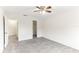 Bright bedroom featuring ceiling fan, carpet, and walk-in closet at 200 Country Club Dr # 802, Largo, FL 33771