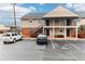 Two-story building exterior on a sunny day, with parking in front at 200 Country Club Dr # 802, Largo, FL 33771