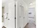 Clean hallway with carpet flooring and doors to other rooms at 200 Country Club Dr # 802, Largo, FL 33771
