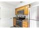 Modern kitchen with stainless steel appliances and granite countertops at 200 Country Club Dr # 802, Largo, FL 33771