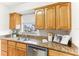 Updated kitchen featuring granite countertops and wood cabinets at 200 Country Club Dr # 802, Largo, FL 33771