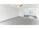 Spacious living room with gray carpet and views to dining area at 200 Country Club Dr # 802, Largo, FL 33771