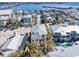 Aerial view of a beautiful home with a rooftop deck and community pool in a coastal setting at 206 Church Ave, Bradenton Beach, FL 34217