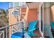 Relaxing balcony with comfortable seating and a view of the neighborhood at 206 Church Ave, Bradenton Beach, FL 34217