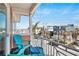 Charming balcony with outdoor seating and scenic neighborhood views at 206 Church Ave, Bradenton Beach, FL 34217
