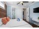 Bedroom features a TV, white desk, ensuite bathroom, and access to other rooms for added convenience at 206 Church Ave, Bradenton Beach, FL 34217