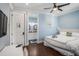 Enjoy this bedroom with access to the bathroom, a white desk, and a comfortable queen size bed at 206 Church Ave, Bradenton Beach, FL 34217