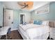 Inviting bedroom features a ceiling fan, desk and a door to the Pearl Suite at 206 Church Ave, Bradenton Beach, FL 34217