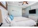 Bright and airy bedroom with white furnishings and calming blue accents at 206 Church Ave, Bradenton Beach, FL 34217