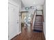Foyer with staircase leading to the second floor and view of a sunny backyard and pool at 206 Church Ave, Bradenton Beach, FL 34217