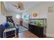 Fun game room with a large fish tank, sofa and arcade game at 206 Church Ave, Bradenton Beach, FL 34217