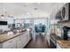 Bright open floor plan with modern kitchen island and dining area at 206 Church Ave, Bradenton Beach, FL 34217