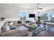 Living room with stylish furnishings, wainscotting, and great natural light at 206 Church Ave, Bradenton Beach, FL 34217