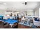 Open-concept living space with pool table, island seating, and comfortable sectional sofa at 206 Church Ave, Bradenton Beach, FL 34217