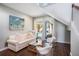 Cozy living room with a plush sofa and access to the pool area at 206 Church Ave, Bradenton Beach, FL 34217