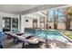 Inviting pool and spa with covered patio and lounge chairs for relaxing by the water at 206 Church Ave, Bradenton Beach, FL 34217