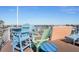 Rooftop deck with vibrant outdoor seating and panoramic views of the coast at 206 Church Ave, Bradenton Beach, FL 34217