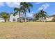 Large backyard with a screened-in pool and gazebo at 214 Bon Vie Pl, Valrico, FL 33594