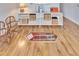 Finished basement with hardwood floors and a unique display case at 214 Bon Vie Pl, Valrico, FL 33594