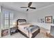Guest bedroom with wood flooring, ceiling fan, and plenty of light at 214 Bon Vie Pl, Valrico, FL 33594