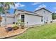 Two-story house with a two-car garage and landscaped yard at 214 Bon Vie Pl, Valrico, FL 33594