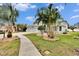 Two-story house with a two-car garage and a landscaped yard at 214 Bon Vie Pl, Valrico, FL 33594