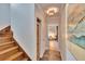 Upstairs hallway with wood stairs, storage, and light flooring at 214 Bon Vie Pl, Valrico, FL 33594