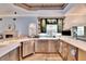 Updated kitchen with custom cabinetry and a large island at 214 Bon Vie Pl, Valrico, FL 33594