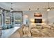 Living area with sectional sofa, pool view, and decorative pillows at 214 Bon Vie Pl, Valrico, FL 33594
