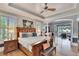 Spacious main bedroom with wood flooring and access to a private patio at 214 Bon Vie Pl, Valrico, FL 33594