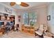 Home office with built-in shelving, large window, and comfortable seating at 214 Bon Vie Pl, Valrico, FL 33594