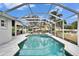 Enclosed pool and spa with a large screened patio area at 214 Bon Vie Pl, Valrico, FL 33594