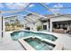 Enclosed pool and spa with a large screened patio area at 214 Bon Vie Pl, Valrico, FL 33594