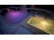 Relaxing pool and spa at night, illuminated at 214 Bon Vie Pl, Valrico, FL 33594