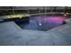 Inviting pool and spa area with colorful night lighting at 214 Bon Vie Pl, Valrico, FL 33594