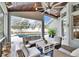 Spacious screened pool area with wicker furniture and pool access at 214 Bon Vie Pl, Valrico, FL 33594