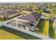 Aerial view of house, fenced backyard, and screened pool at 2424 Dakota Rock Dr, Ruskin, FL 33570