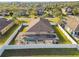Aerial view of house and backyard with pool and screened enclosure at 2424 Dakota Rock Dr, Ruskin, FL 33570