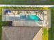 Aerial view of a home with a screened pool and spa at 2424 Dakota Rock Dr, Ruskin, FL 33570