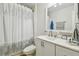 Bathroom with white vanity, toilet and shower at 2424 Dakota Rock Dr, Ruskin, FL 33570