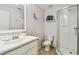 Bathroom with a shower, toilet and white vanity at 2424 Dakota Rock Dr, Ruskin, FL 33570
