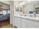 Double vanity bathroom with access to bedroom and shower at 2424 Dakota Rock Dr, Ruskin, FL 33570