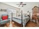 Cozy bedroom with wood flooring and a comfortable bed at 2424 Dakota Rock Dr, Ruskin, FL 33570