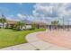 Community pool with solar panels and a paved walkway at 2424 Dakota Rock Dr, Ruskin, FL 33570