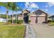 One-story home with a two-car garage and landscaped front yard at 2424 Dakota Rock Dr, Ruskin, FL 33570