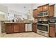 Kitchen boasts granite countertops and ample wood cabinetry at 2424 Dakota Rock Dr, Ruskin, FL 33570
