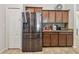 Sleek kitchen with stainless steel refrigerator and wood cabinets at 2424 Dakota Rock Dr, Ruskin, FL 33570
