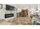 Living area with electric fireplace and kitchen views at 2424 Dakota Rock Dr, Ruskin, FL 33570