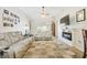 Bright living room featuring comfortable seating, a fireplace, and large TV at 2424 Dakota Rock Dr, Ruskin, FL 33570